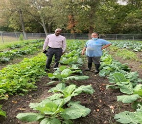 Joyner and Williams standing in the garden. 