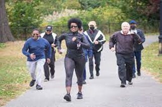 Group of people jogging on a path. 