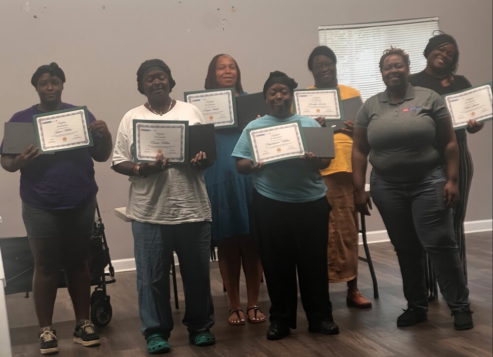 Computer Basics Class participants smiling for a photo.