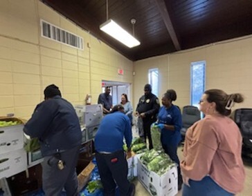 RMHA staff and voluteers packing food boxes.